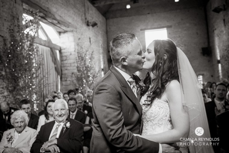 kiss  ceremony Cripps barn  Cotwold wedding photography
