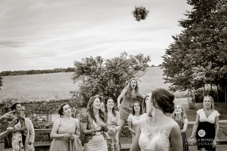 bouquet toss Cripps Barn beautiful wedding photography Cotswolds