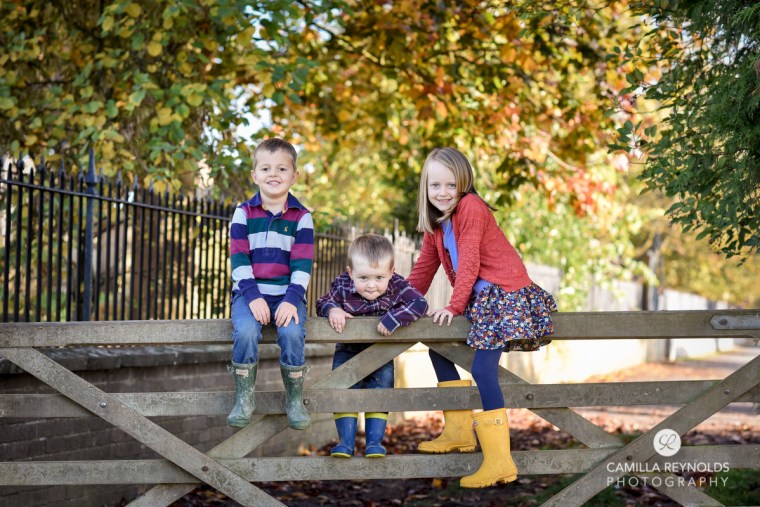 children on fence natural photography stroud