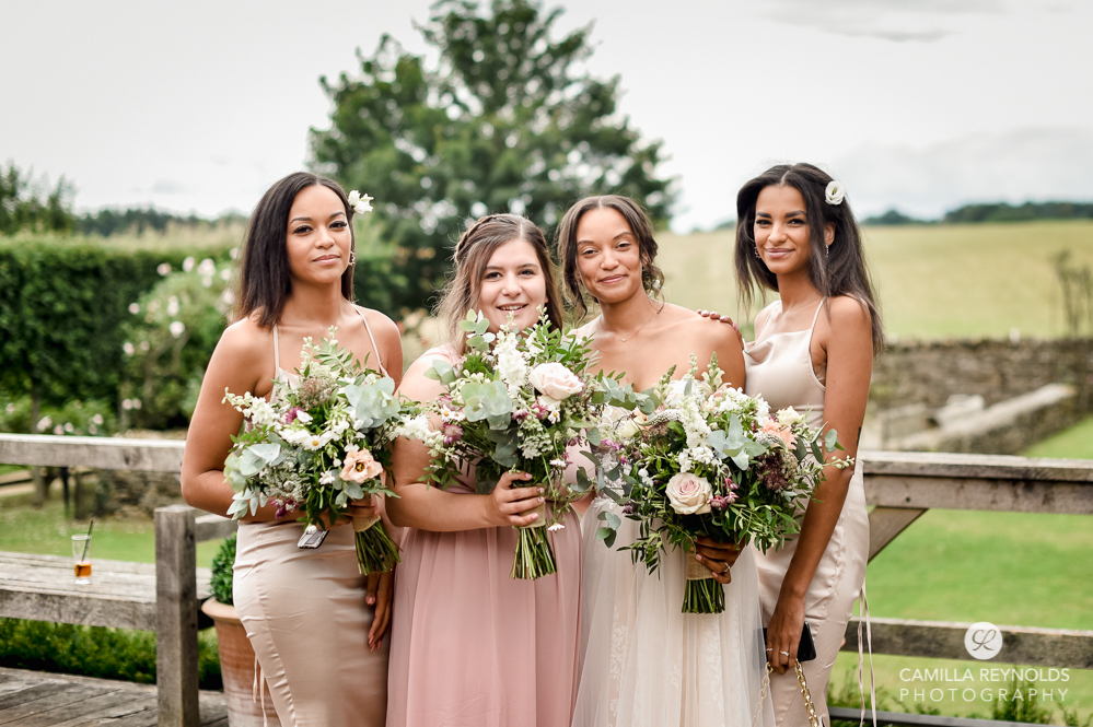bride and bridesmaids in pink beige dresses cripps barn