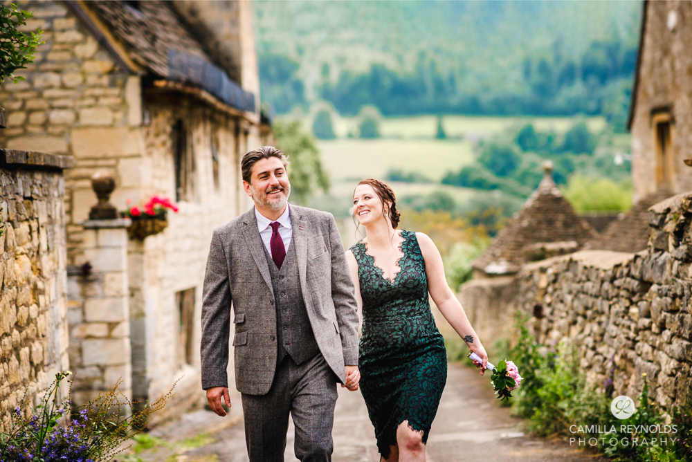 postcard pretty cotswold village wedding couple walking 