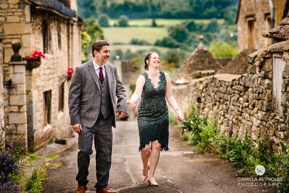couple walking holding hands natural family wedding photography Cotswolds
