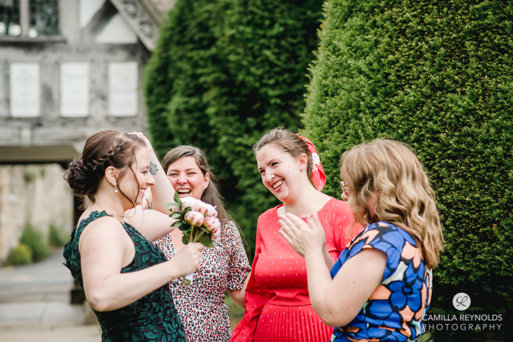 fun natural wedding photography st marys church painswick gloucestershire