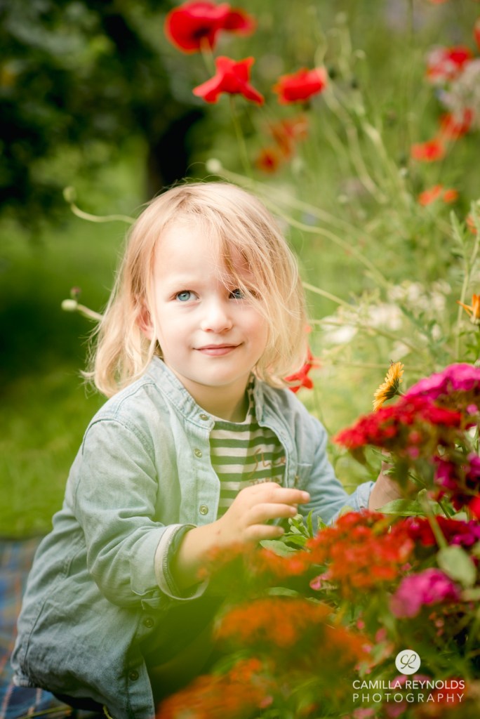 boy with garden flowers countryside cotswolds