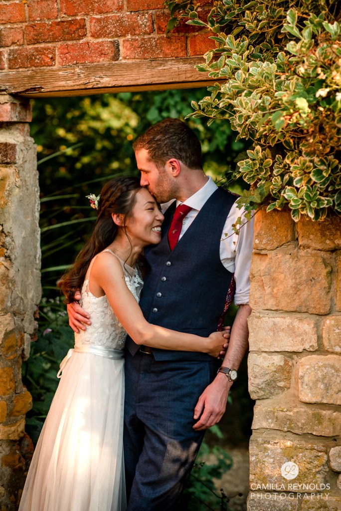 bride and groom kissing evening light natural  wedding photography