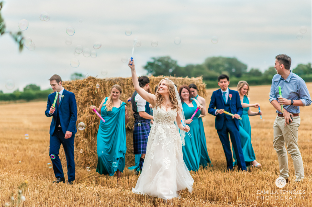 countryside field wedding with hay bales cotswold photography