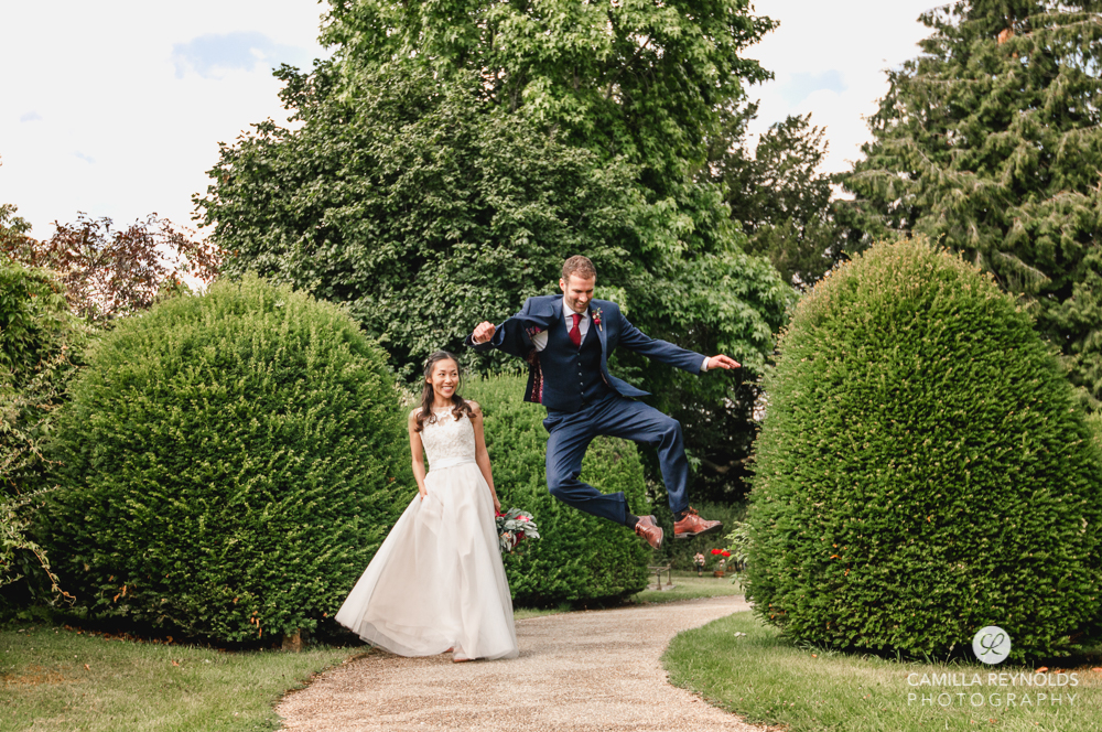 groom jumping fun wedding photography uk