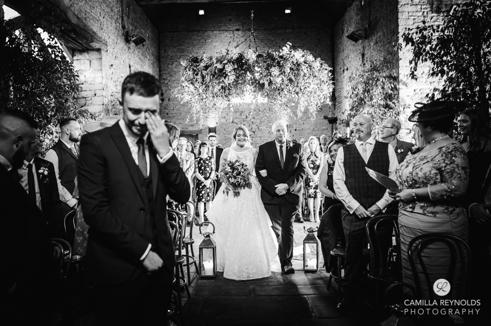 bride walking down the aisle cripps barn cotswold wedding