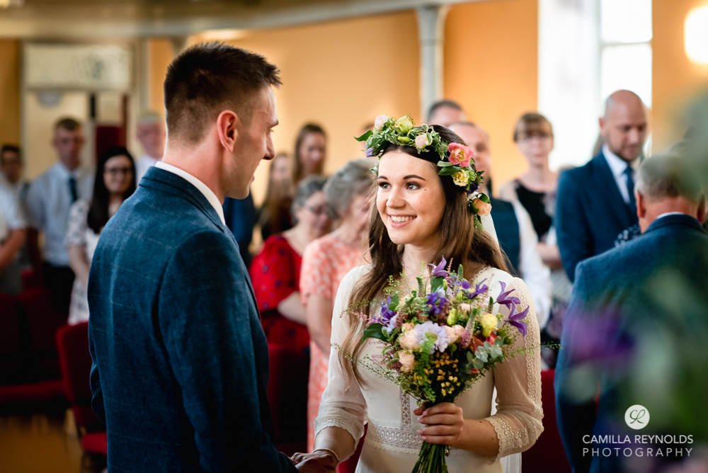 bride and groom saying wedding vows at christ church nailsworth gloucestershire uk