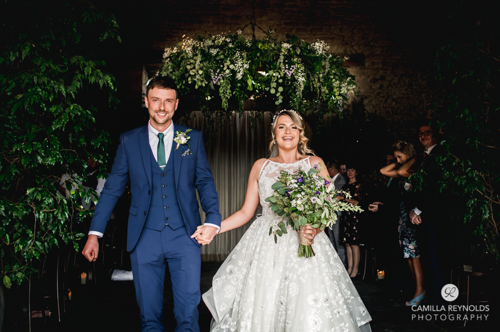bride and groom walking cripps barn gloucestershire photography