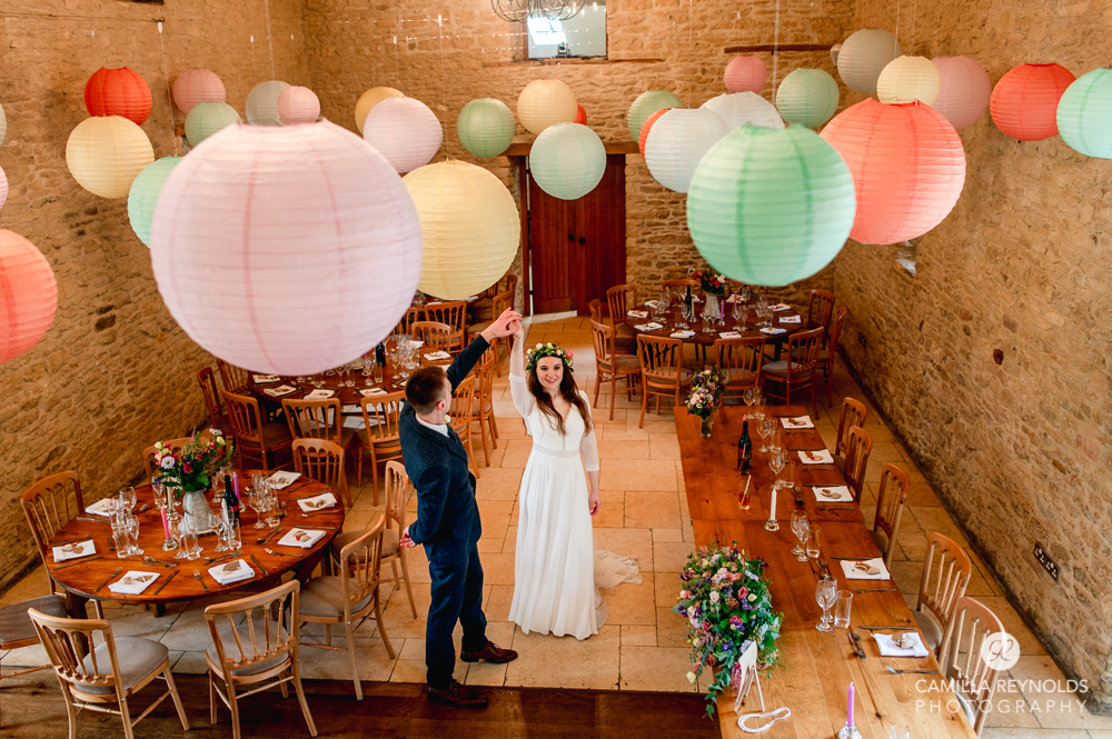 bride and groom dancing at Kingscote barn  wedding photography cotdwolds uk