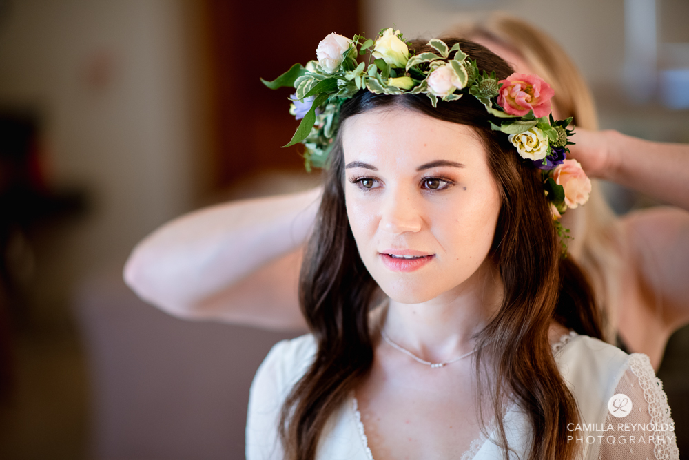 bride wearing flower crown wedding at Kingscote barn gloucestershire