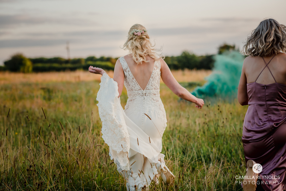 bride walking in the field romantic natural wedding photography