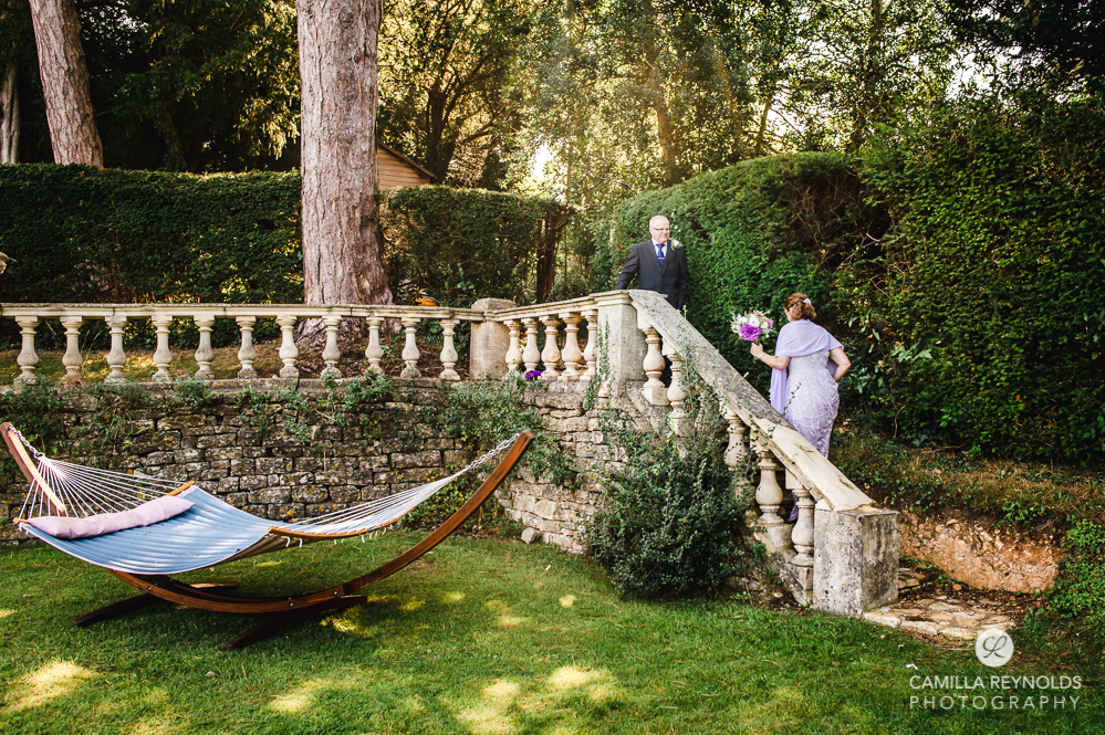 stroud wedding burleigh court bride and groom on stairs cotswolds