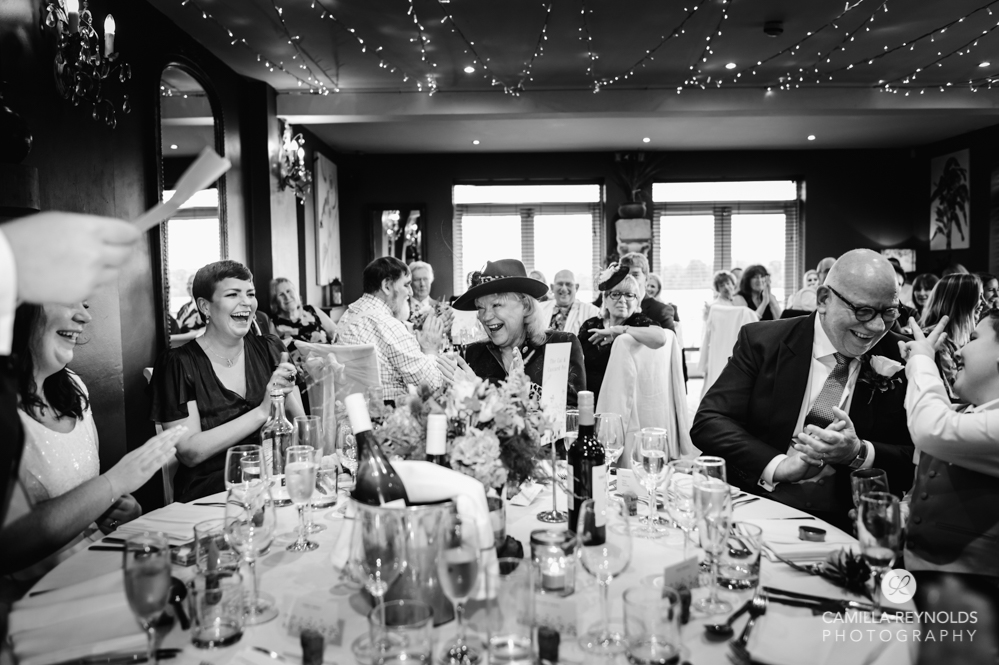 wedding guests laughing the old lodge gloucestershire photography