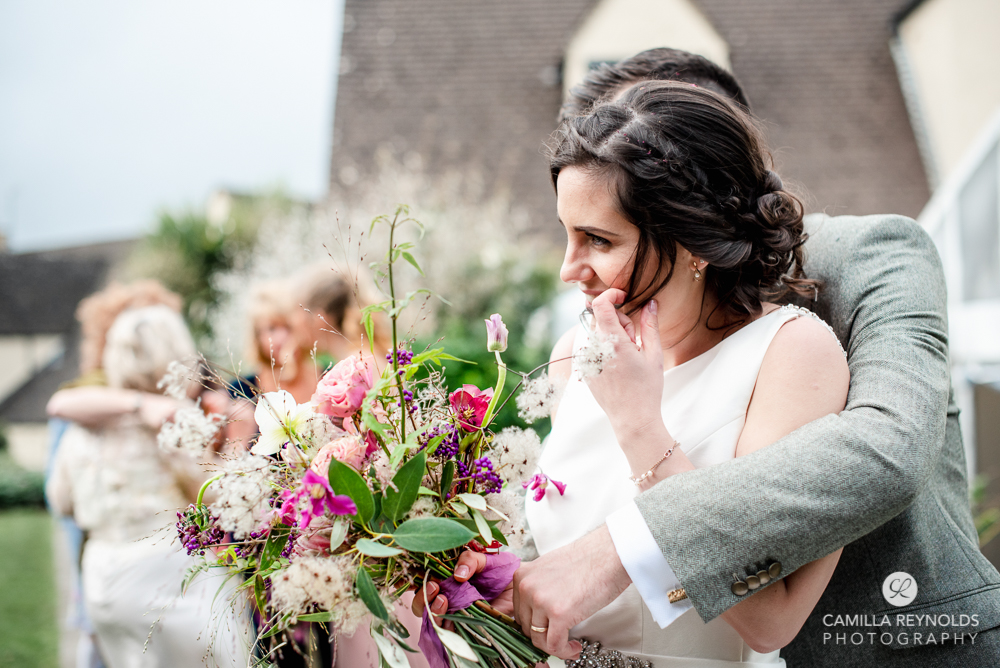 bride and groom hugging natural wedding photography