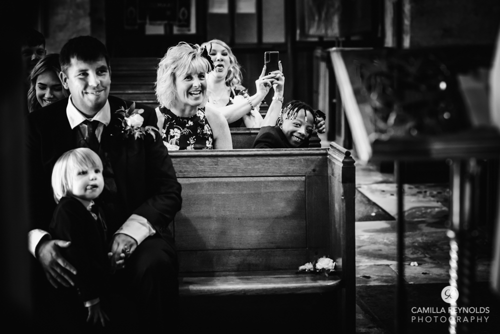 guests laughing documentary wedding photo black and white
