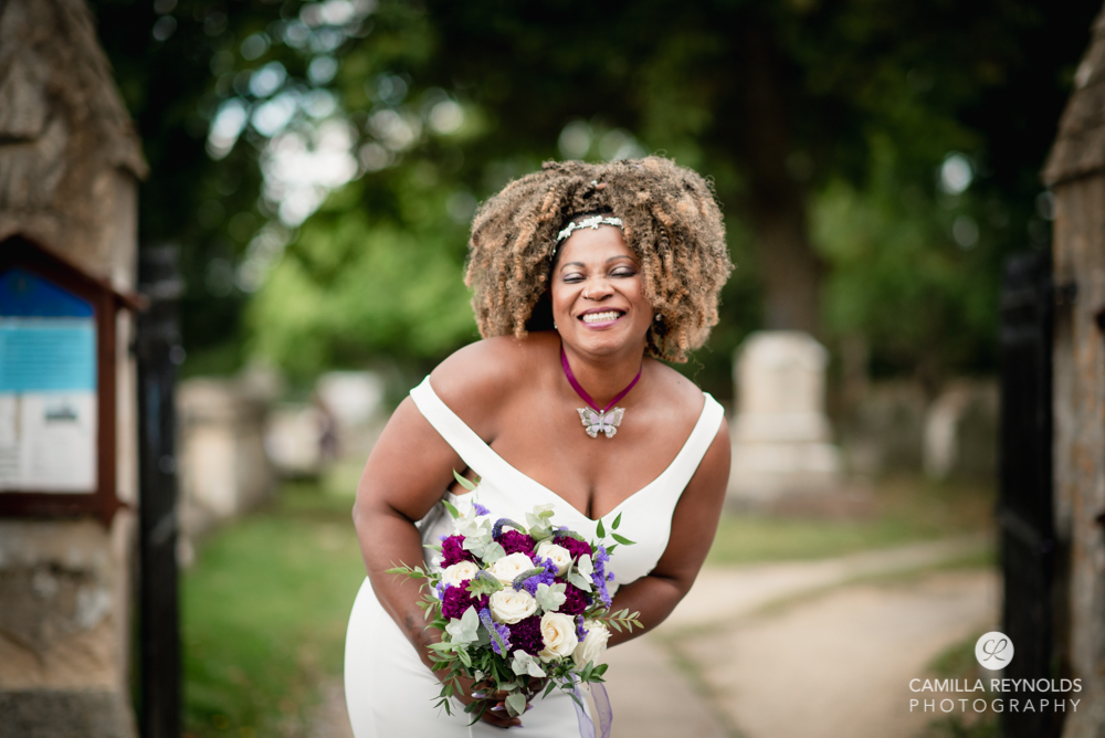 dark skinned bride laughing cotswold wedding photography 