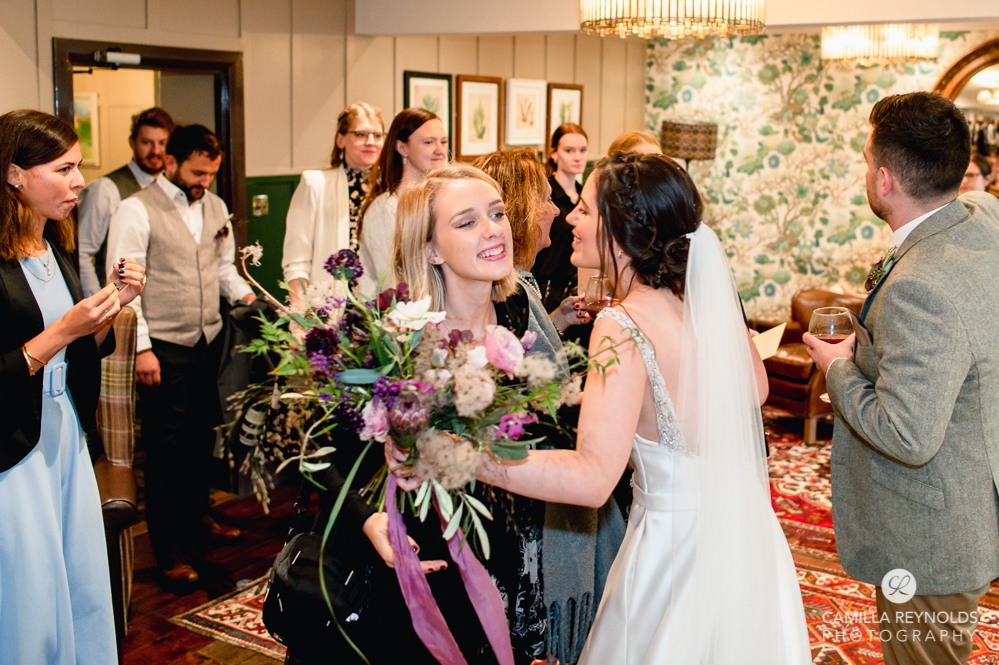 bride kissing bear of rodborough cotswolds