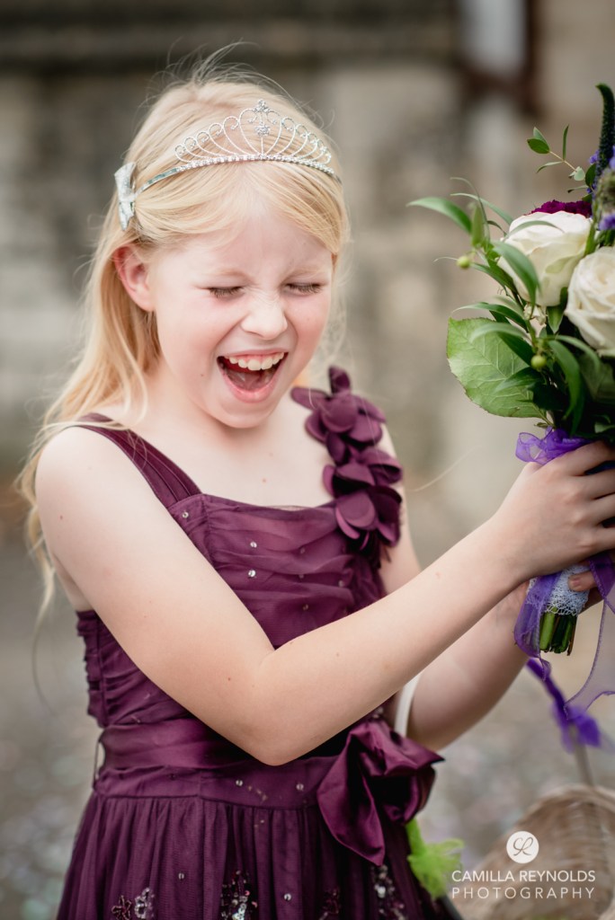 flower girl laughing purple dress