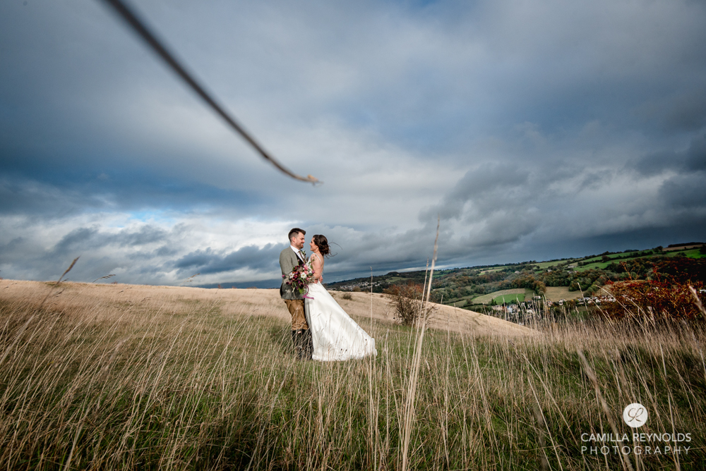 bride and groom in amazing cotswold landscape stroud