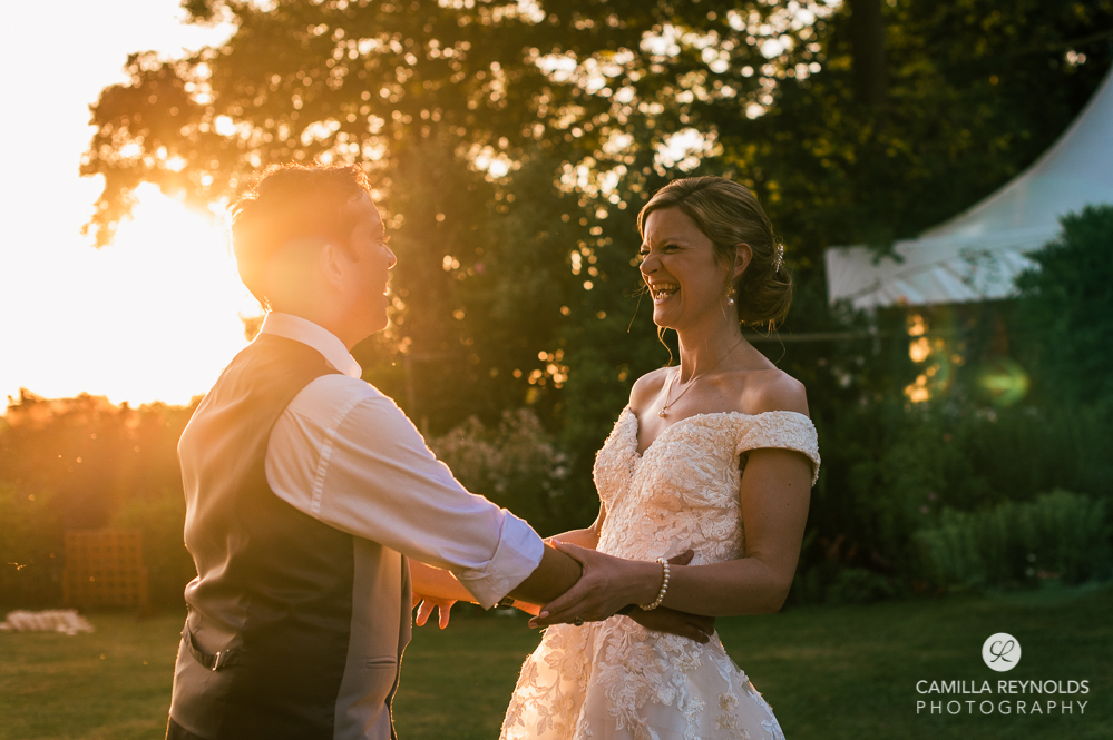 bride groom laughing sunset warm dramatic wedding photography cotswolds