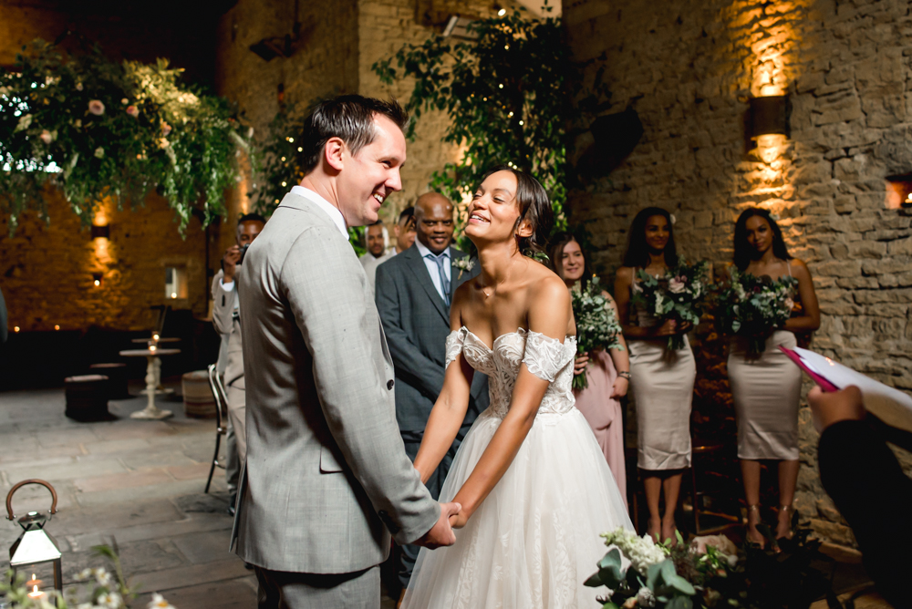 bride groom laughing wedding ceremony old gore barn cotswolds