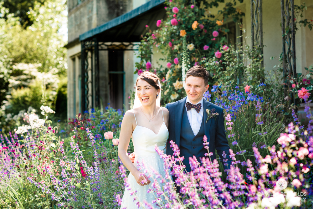 bride and groom in flowers gloucestershire wedding