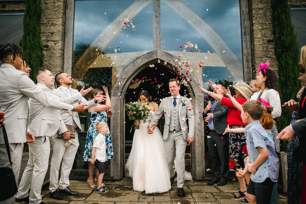 bride and groom confetti wedding photography cotwolds 