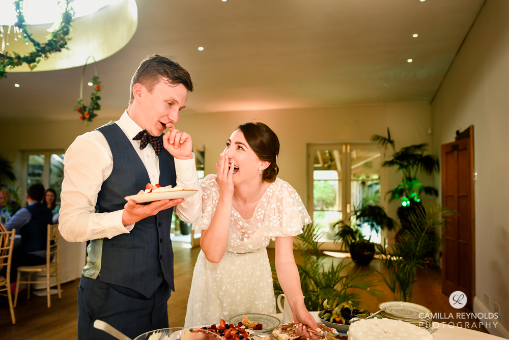 wedding cake cutting fun photography oxfordshire