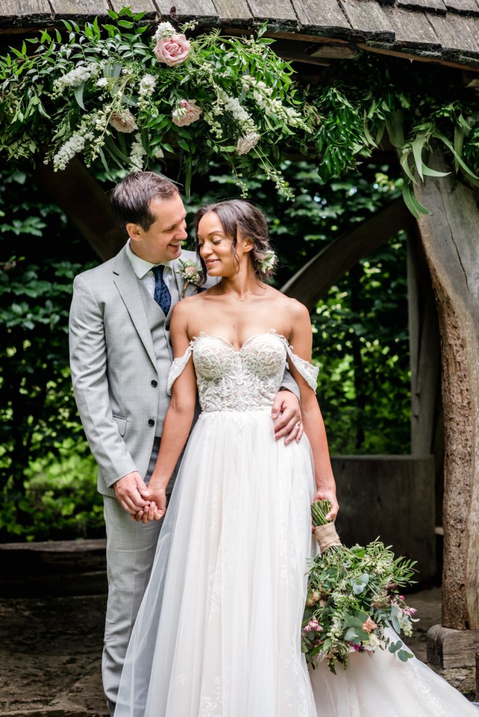 bride and groom flower arch