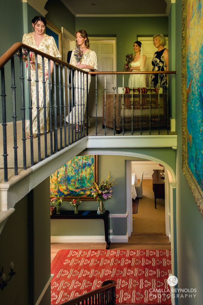 bride going downstarirs wedding photography gloucestershire