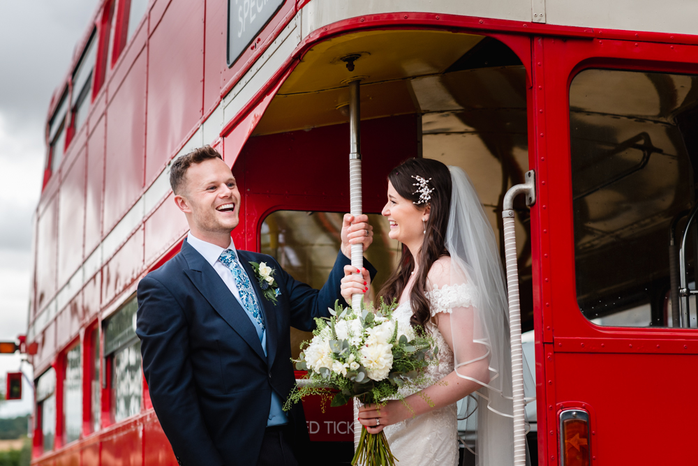 bride and groom red london bus