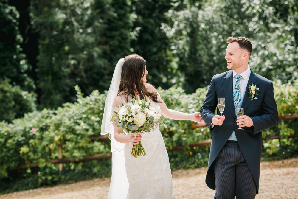 bride and groom walking natural wedding photography