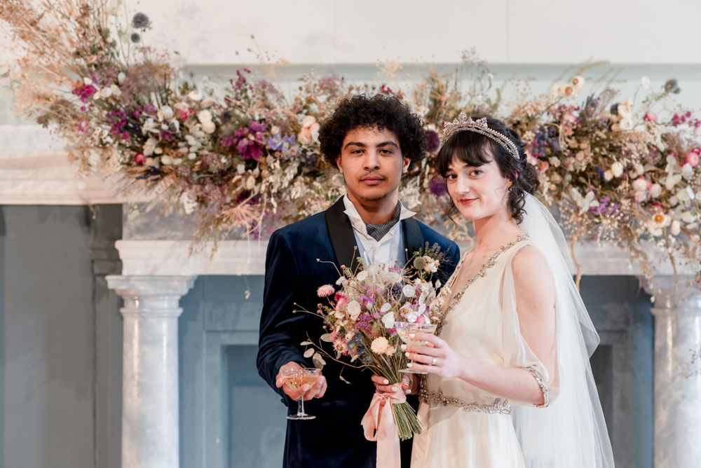bride and groom with a floral centerpiece wedding