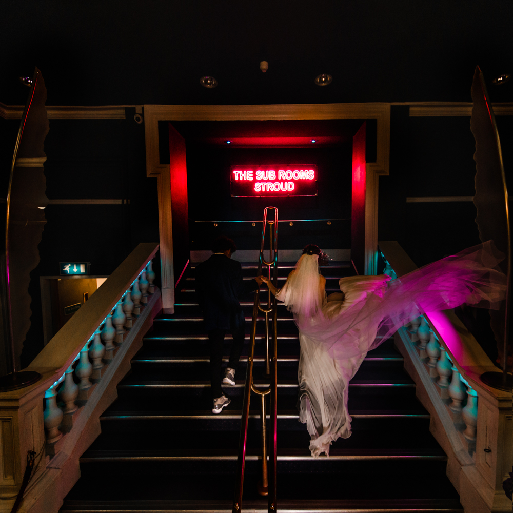 bride and groom staircase dramatic wedding photography cotswolds