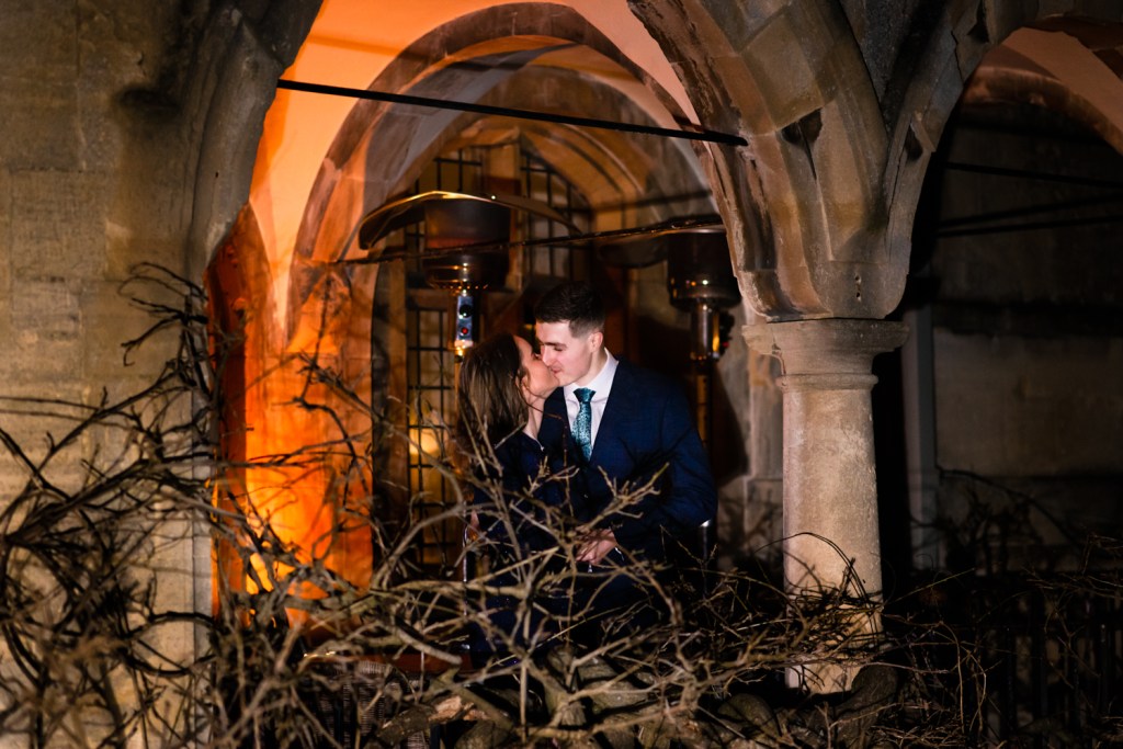 couple kissing balcony wedding photography