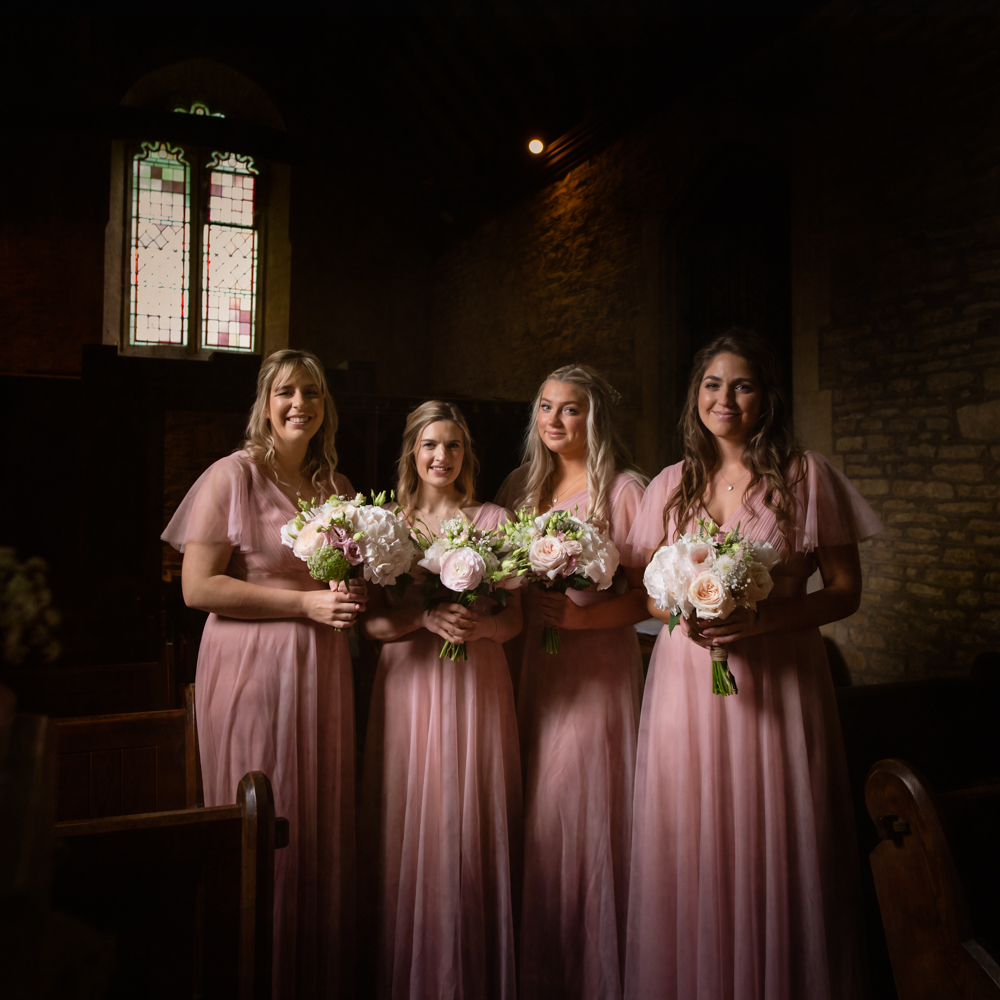 bridesmaids church portrait dramatic light