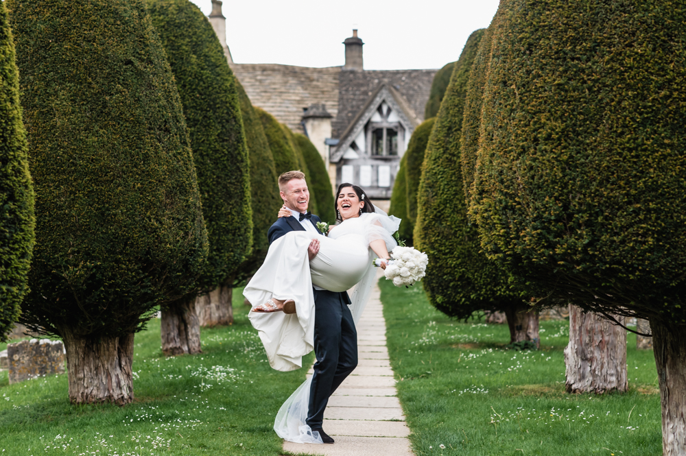 painswick church yew trees bride and groom