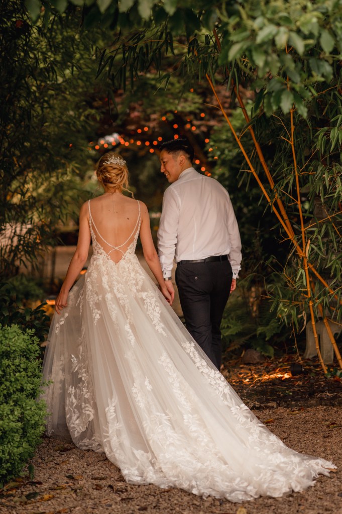 bride and groom walking matara cotswolds