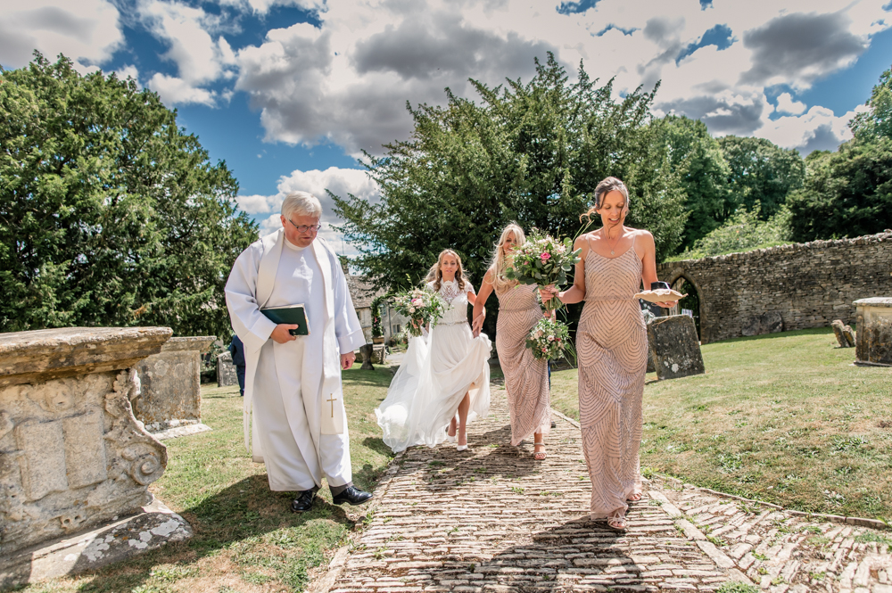 bride walking cotswolds wedding photography