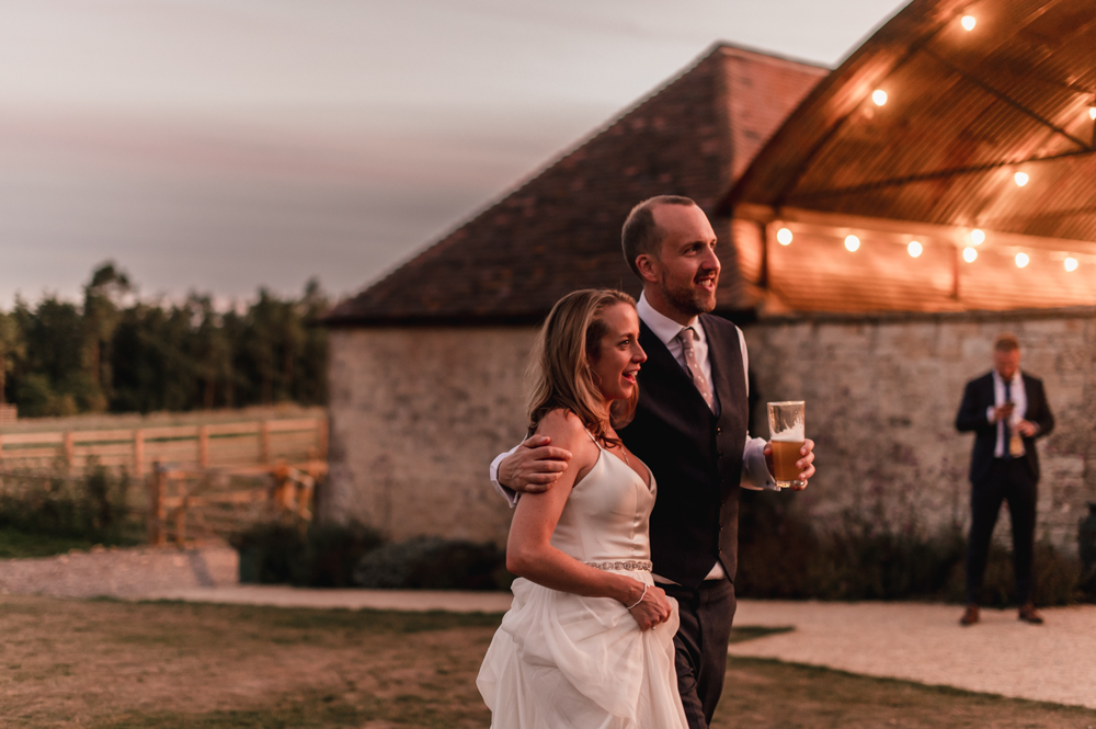 bride and groom walking evening old gore barn