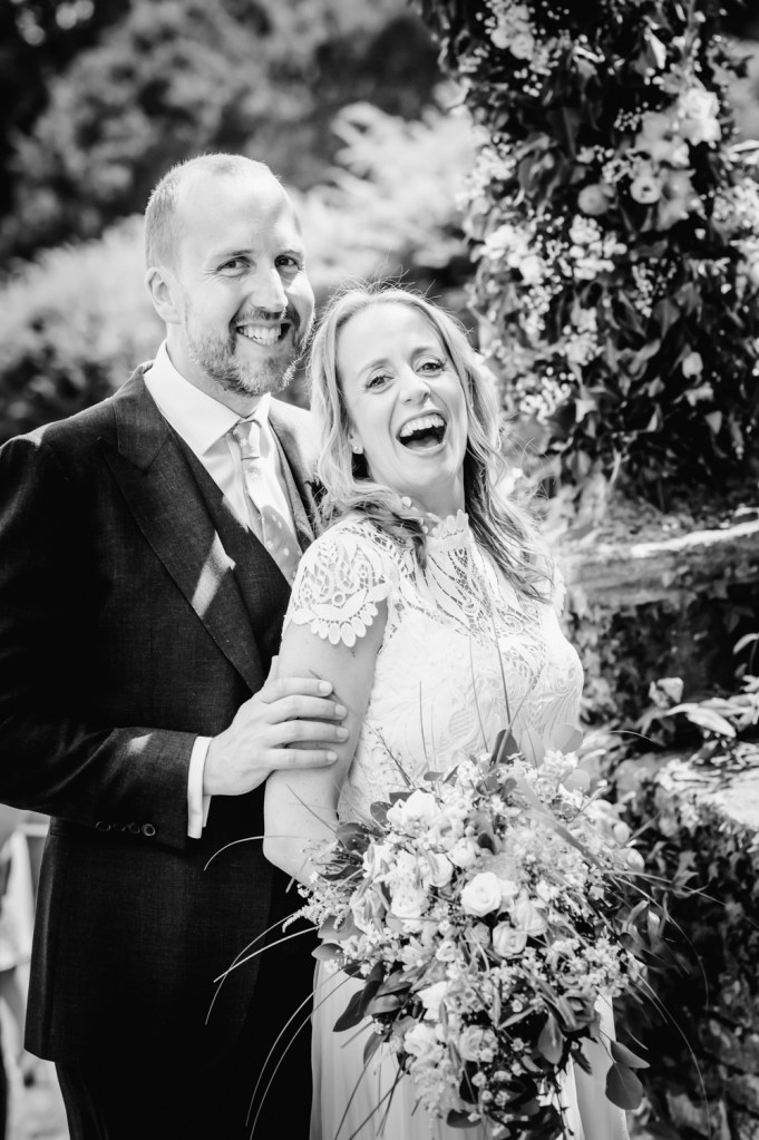 bride and groom laughing