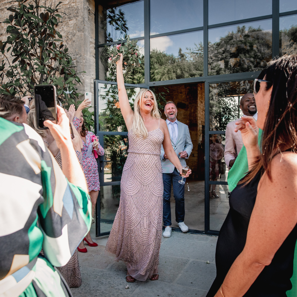 bouquet toss cotswold wedding photography