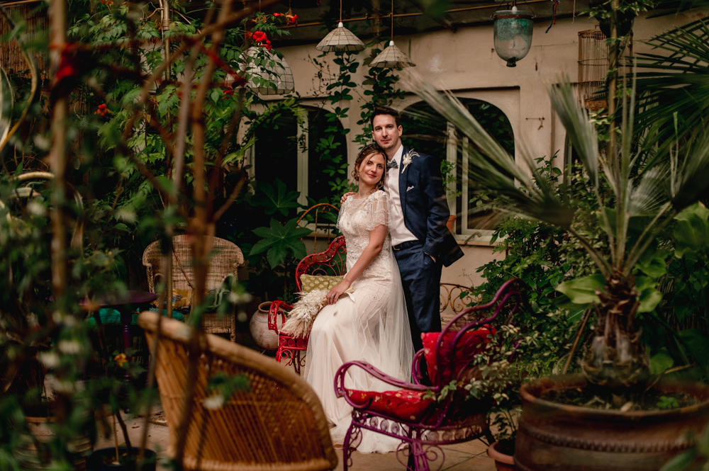 bride and groom in a tropical greenhouse matara