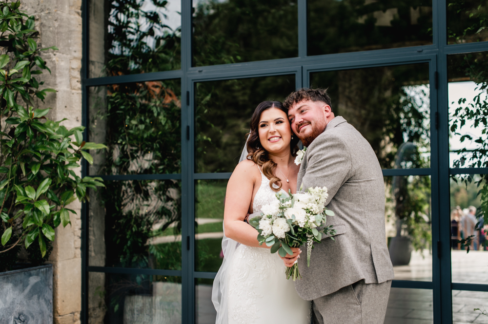 bride and groom hugging