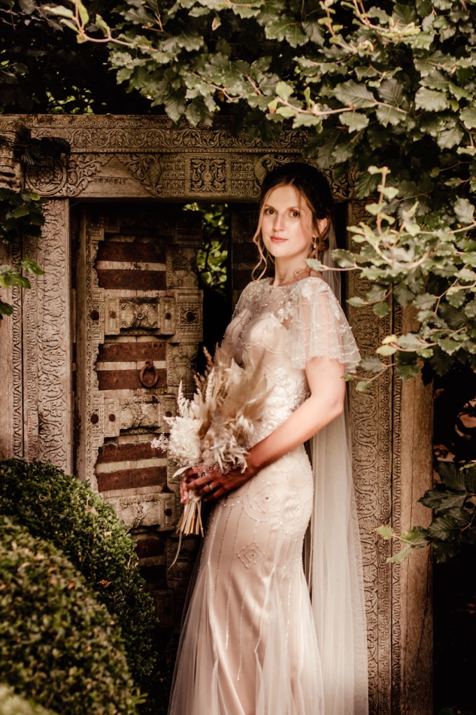 bride with dried bouquet matara centre wedding