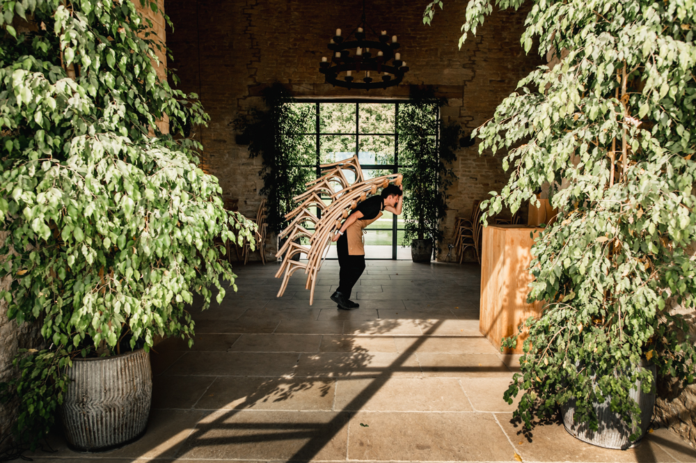 waiter carrying chairs old gore