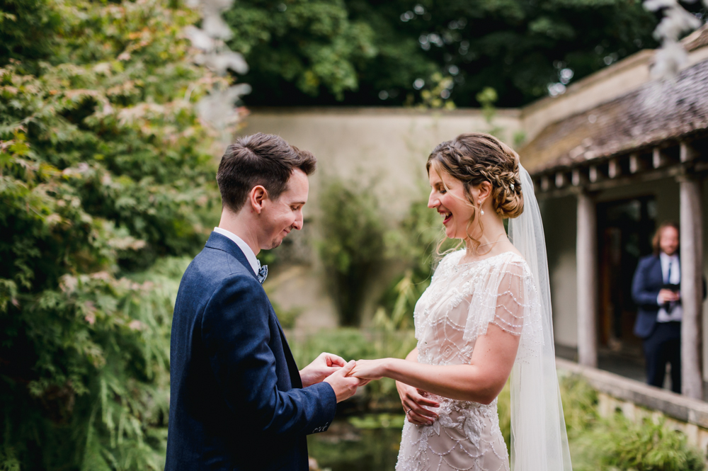 exchange of rings wedding ceremony outside matara centre cotswolds