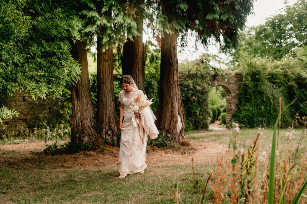 bride walking in the garden